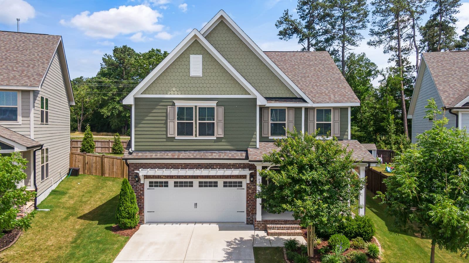Home with fresh landscaping beds and a healthy lawn